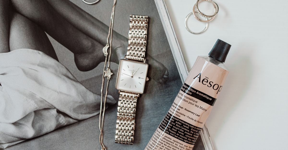 Minimalist men's skincare products on a wooden surface