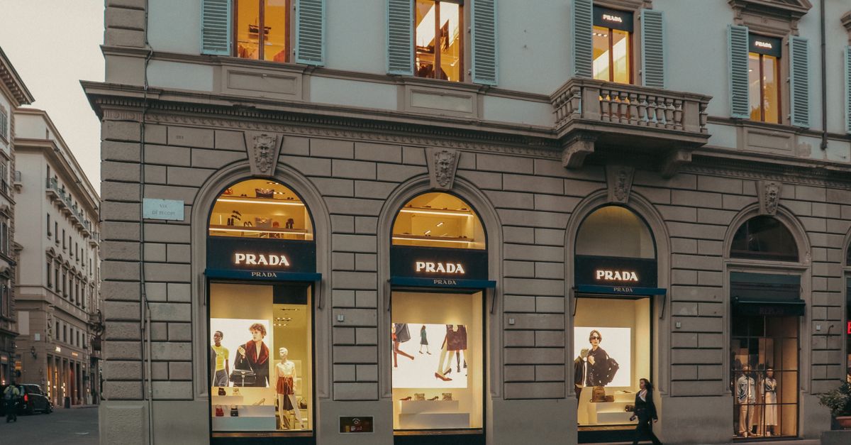 Luxury boutique façade in Paris with elaborate window displays and Haussmann architecture