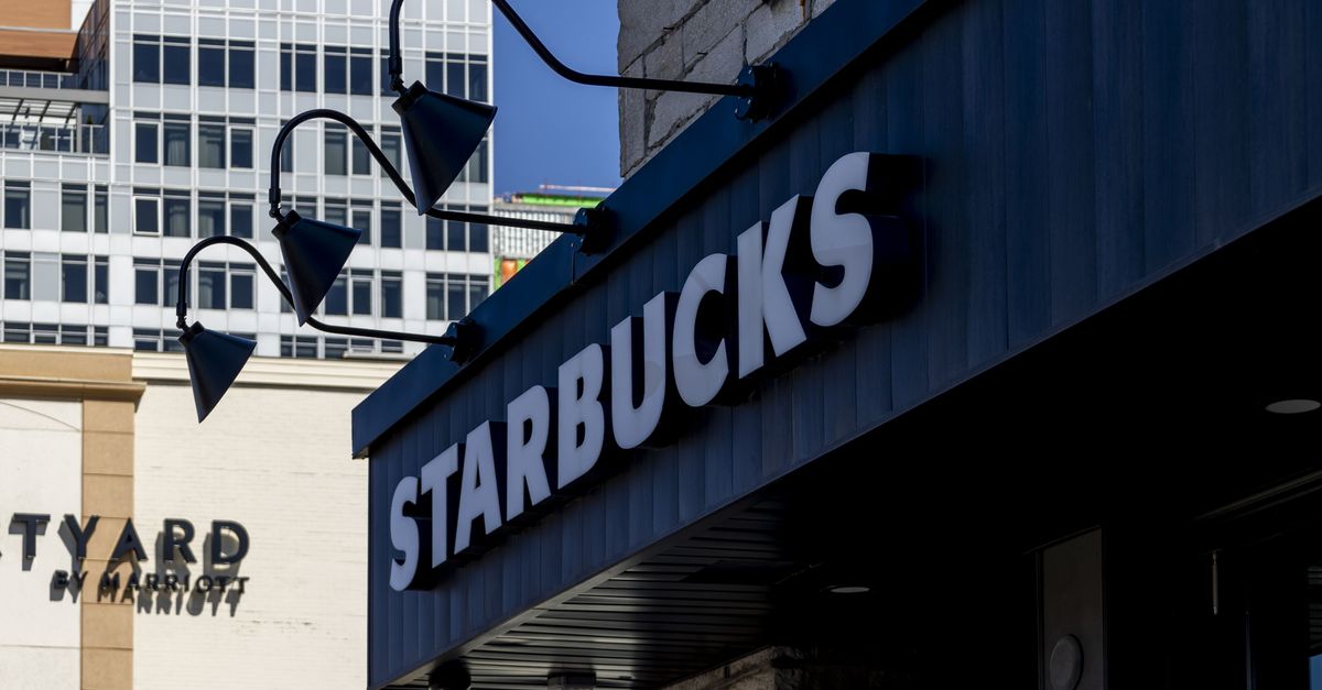 Starbucks café interior with counter, green logo and contemporary warm décor